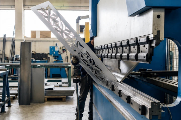 Fabricator forming a patterned metal panel on a press brake